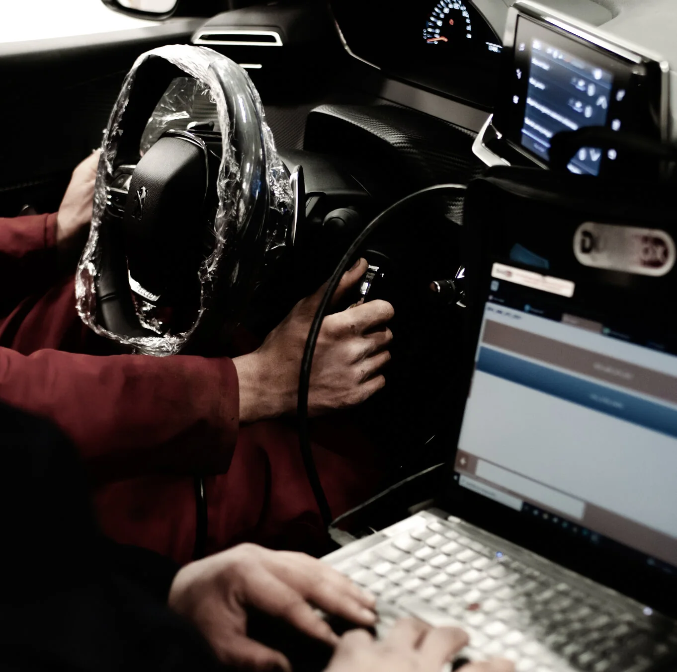 Technician reviewing vehicle diagnostic information